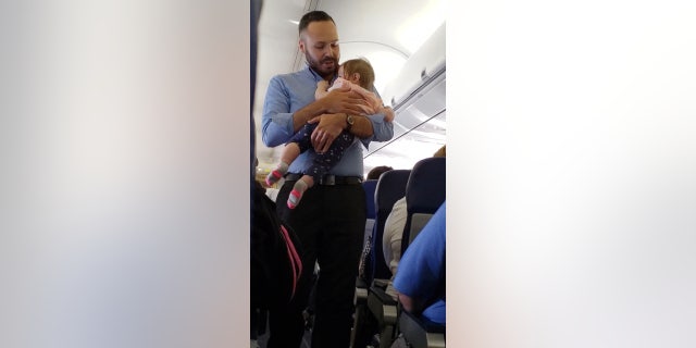 Southwest staffer Wesley Hunt, pictured, said that comforting baby Alayna was simply the right thing to do.
