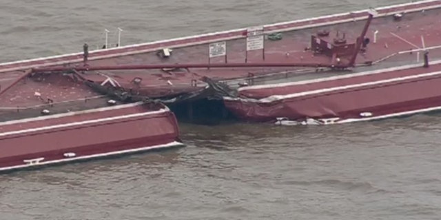 A tug carrying two barges collided with a 755-foot tanker in the Houston Ship Channel on Friday, sinking one of the barges and spilling chemicals used for gasoline manufacturing.