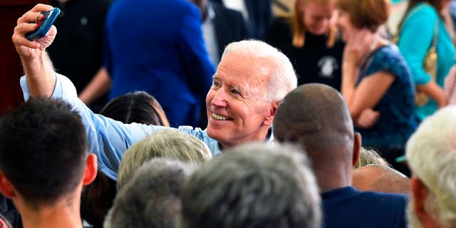 Former Vice President Joe Biden takes photos with supporters following the first rally of his 2020 campaign, Saturday, May 4, 2019 in Columbia, S.C. (AP Photo/Meg Kinnard)