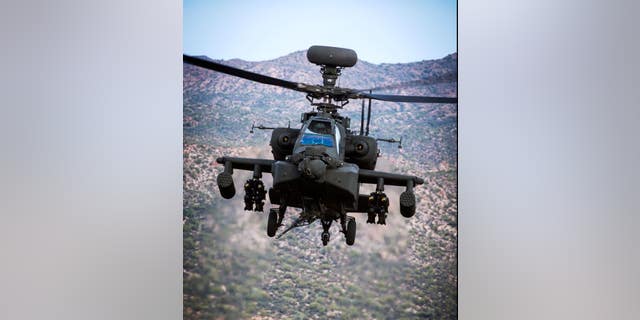 A Boeing AH-64 Apache helicopter is shown.