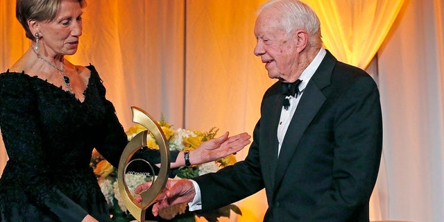 Former President Jimmy Carter accepts the O'Connor Justice Prize from the former U.S. ambassador to Finland, Barbara Barrett, in 2017. (AP Photo/Ross D. Franklin, File)