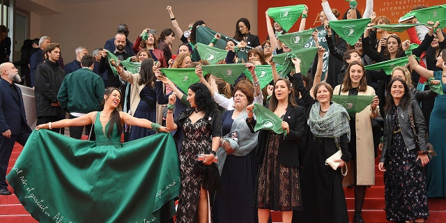 Cast and crew of the film "Let It Be Law" demonstrate for the legalization of abortion in Argentina upon arrival at the premiere of the film "The Wild Goose Lake" at the Cannes Film Festival on Saturday, May 18, 2019.