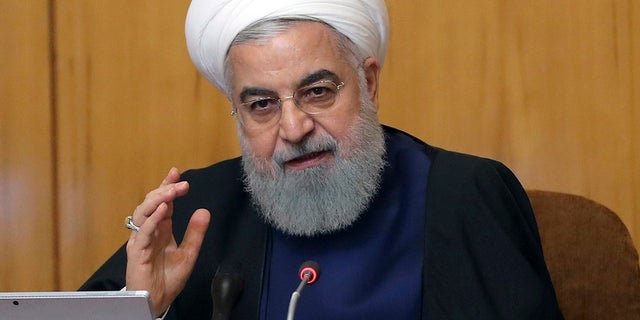 Iranian President Hassan Rouhani speaks in a cabinet meeting in Tehran, Iran, Wednesday, May 8, 2019. Rouhani said Wednesday that it will begin keeping its excess uranium and heavy water from its nuclear program, setting a 60-day deadline for new terms to its nuclear deal with world powers before it will resume higher uranium enrichment. (Iranian Presidency Office via AP)