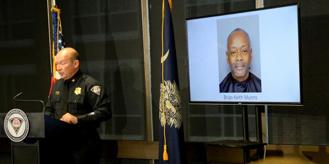 A Greenville police photo of arrested suspect Brian Keith Munns is displayed as police chief Ken Miller talks about an arrest in the 1988 cold case homicide of Alice Haynesworth Ryan.