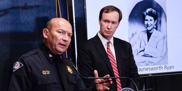 Greenville police Chief Ken Miller, left, talks near Thirteenth Circuit Solicitor Walt Wilkins, right, about an arrest in the 1988 cold case homicide of Alice Haynesworth Ryan.