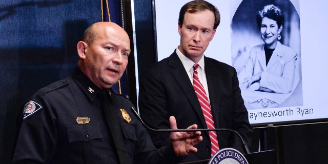Greenville police Chief Ken Miller, left, talks near Thirteenth Circuit Solicitor Walt Wilkins, right, about an arrest in the 1988 cold case homicide of Alice Haynesworth Ryan.