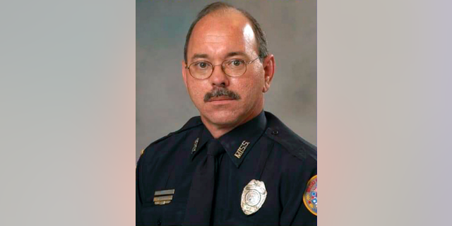 CORRECTS FIRST NAME TO ROBERT, NOT JOHN - This photo provided by the City of Biloxi, Miss., Public Affairs Department shows police officer Robert McKeithen who was killed Sunday night, May, 5, outside the department building in Biloxi. (City of Biloxi, Miss., Public Affairs via AP)