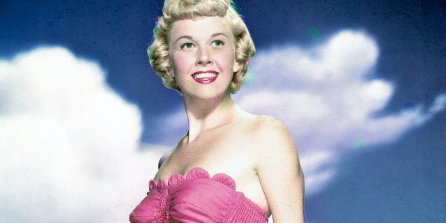 Doris Day is pictured in a pink swimsuit in 1955. The legendary actress and singer passed away on May 13, 2019 at 97 years old.