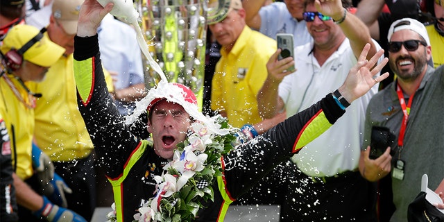 Simon Pagenaud, of France, celebrating after winning the Indianapolis 500 on Sunday. (AP Photo/Michael Conroy)