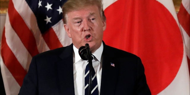 President Donald Trump speaks as he meets with Japanese business leaders, Saturday, in Tokyo. (Associated Press)