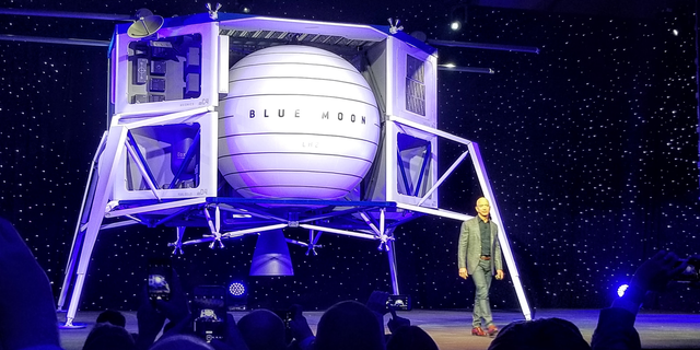 Blue Origin founder Jeff Bezos unveils a mockup of the Blue Moon lunar lander on May 9, 2019.