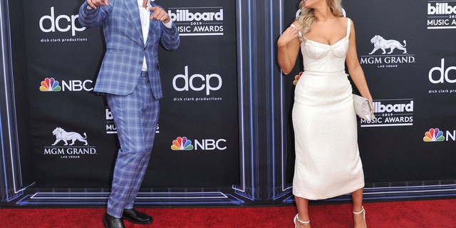 Rob Gronkowski, left, and Camille Kostek arrive at the Billboard Music Awards on Wednesday, May 1, 2019, at the MGM Grand Garden Arena in Las Vegas. (Photo by Richard Shotwell/Invision/AP)