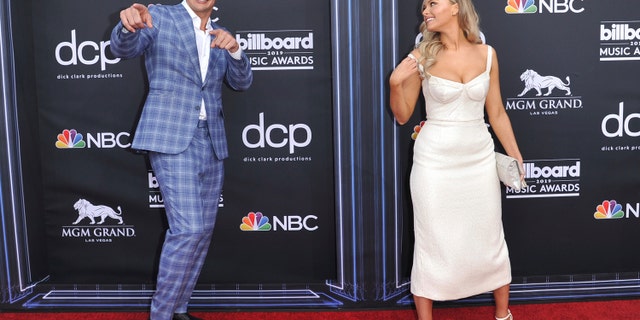 Rob Gronkowski, left, and Camille Kostek arrive at the Billboard Music Awards on Wednesday, May 1, 2019, at the MGM Grand Garden Arena in Las Vegas. (Photo by Richard Shotwell/Invision/AP)