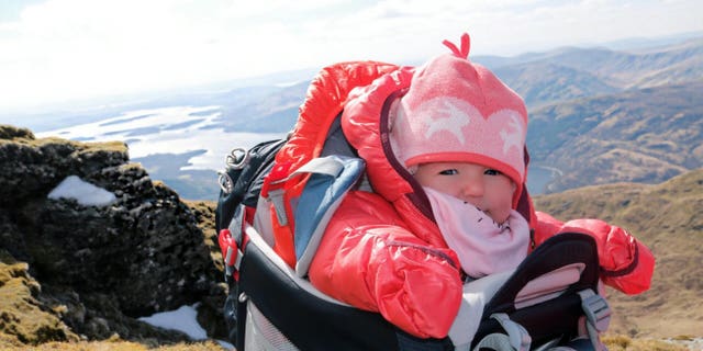 The longest walk Lara has been on was about six hours long, but most are much shorter, and she travels in a little red outfit which looks like a sleeping bag, and always wears a hat to keep her head warm.