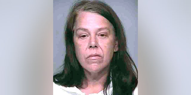 Brennan allegedly set a bottle of gin on her dead mother's stomach after the murder. (AP)