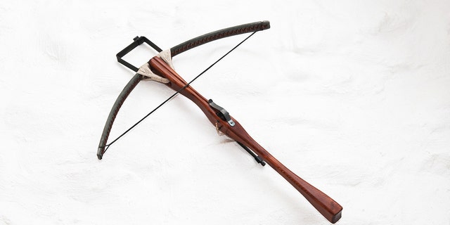 An antique crossbow. Police are investigating the deaths of three hotel guests after they were found dead with crossbow bolts in them and two crossbows nearby.