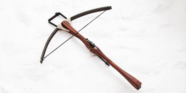 An antique crossbow. Police are investigating the deaths of three hotel guests after they were found dead with crossbow bolts in them and two crossbows nearby.