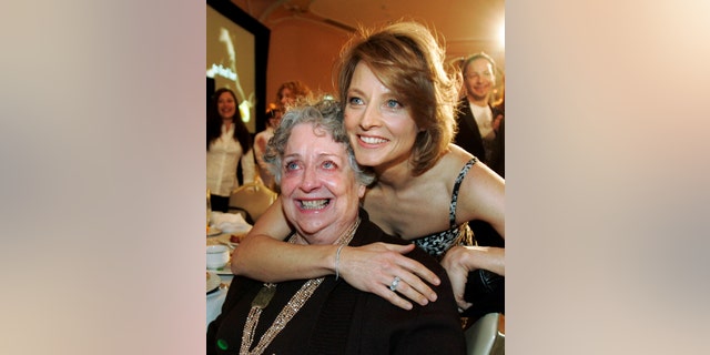 FILE - This Dec. 4, 2007 file photo shows actress-director Jodie Foster, right, with her mother Evelyn Foster after she received the Sherry Lansing Leadership Award at during the 16th annual Women in Entertainment breakfast in Beverly Hills, Calif. Evelyn “Brandy” Foster, who managed her daughter Jodie’s career from her child-prodigy years through two Academy Awards, died peacefully at her Los Angeles home of complications from dementia, Monday, May 13, 2019.