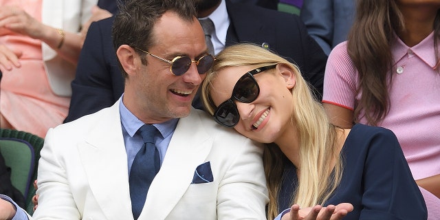 Jude Law and Phillipa Coan attend day eleven of the Wimbledon Tennis Championships at Wimbledon on July 08, 2016 in London, England.