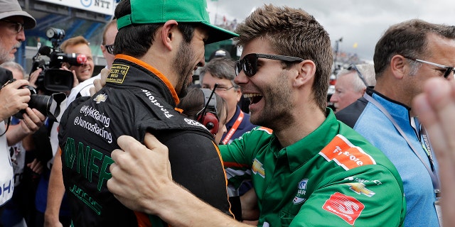 Kaiser (hat) celebrated with his team after qualifying for the race.