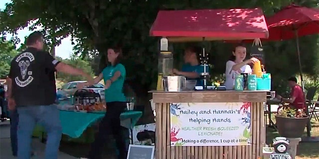Two young sisters are turning lemons into lemonade through their efforts to pay off their local school district’s $41,000 lunch debt, by running a charitable lemonade stand.