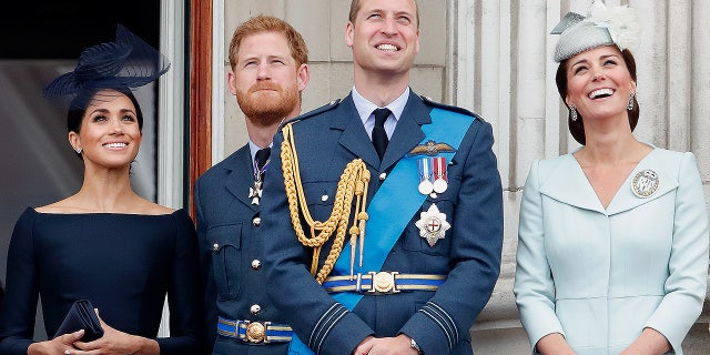Meghan, Duchess of Sussex, Prince Harry, Duke of Sussex, Prince William, Duke of Cambridge and Catherine, Duchess of Cambridge watch a flypast to mark the centenary of the Royal Air Force from the balcony of Buckingham Palace on July 10, 2018, in London. The 100th birthday of the RAF, which was founded on April 1, 1918, was marked with a centenary parade with the presentation of a new Queen's Colour and flypast of 100 aircraft over Buckingham Palace.