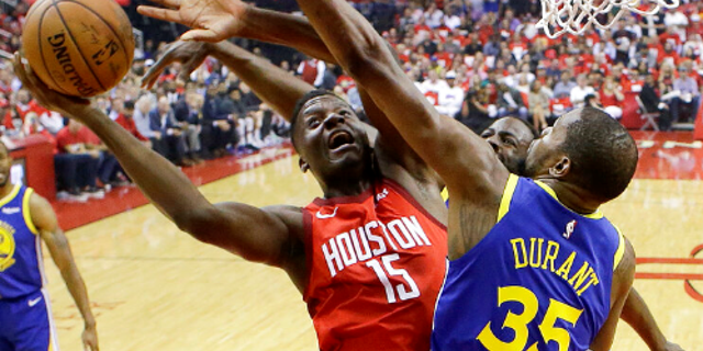 Houston Rockets center Clint Capela (15) shoots as Golden State Warriors forward Kevin Durant (35) defends during the first half of Game 4 of a second-round NBA basketball playoff series.