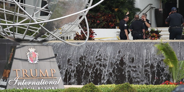 Sunny Isles Beach police officers work near the entrance to the Trump International Beach Resort as they investigate a shooting that reports say involved rapper NBA Youngboy on the street in front of the resort on Sunday. Police continue to investigate the scene.