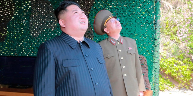 This Saturday, May 4, 2019, photo provided on Sunday, May 5, 2019, by the North Korean government shows North Korean leader Kim Jong Un observing tests of different weapons systems, in North Korea.