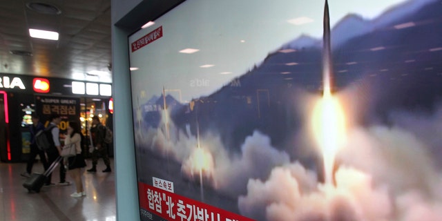 A TV screen shows a file footage of North Korea's missile launch during a news program at the Seoul Railway Station in Seoul, South Korea, Saturday, May 4, 2019.