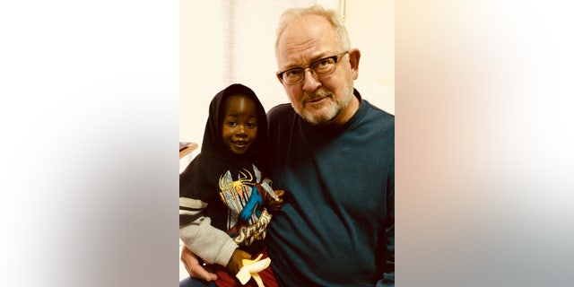 Dr. Novick and a patient, Emanuel