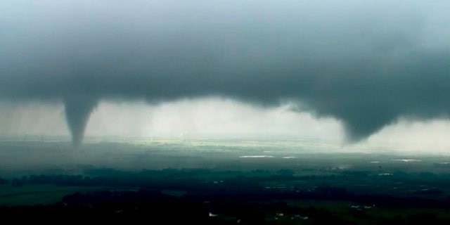 This image made from video provided by KWTV-KOTV shows two funnel clouds formed in Crescent, Okla., Monday, May 20, 2019.