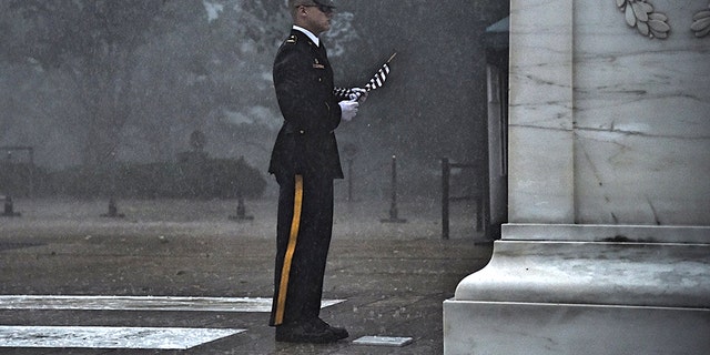 A severe thunderstorm Thursday failed to stop a sentinel from placing a flag at the Tomb of the Unknown Soldier.
