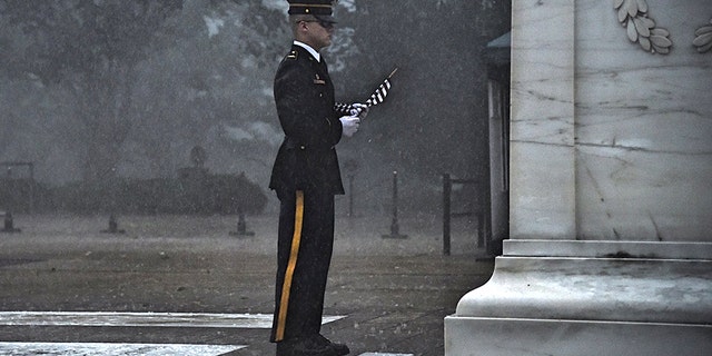 A severe thunderstorm Thursday failed to stop a sentinel from placing a flag at the Tomb of the Unknown Soldier.