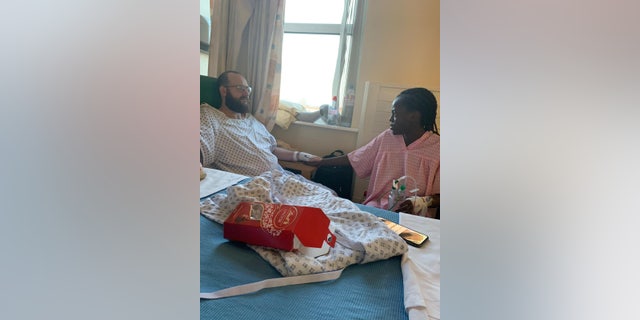 Geraldine Chingosho, 22 with fiancé Aldo Cataldi, 27, moments before their kidney transplant at Leicester General Hospital, Feb.