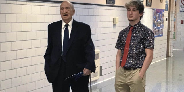 Pete Sabedra, 91, spending time with his grandson, Derry Area High School senior Kace Sabedra, after Pete received his honorary diploma from the school at Derry Area's annual awards ceremony in Derry, Pa. (Jeff Himler/Pittsburgh Tribune-Review via AP)