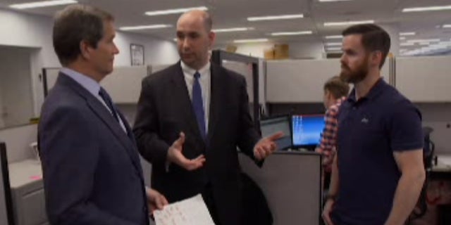 Jon Scott talks with Assistant Director in Charge William Sweeney and FBI Special Agent Brian Gander.
