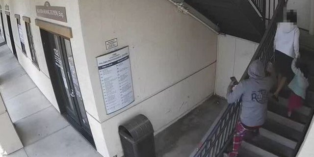 A man identified by police as Pablo Cabrera can be seen approaching a woman and her daughter from behind before snatching her house on May 6.