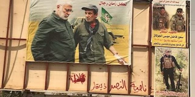 A poster of Qassem Soleimani adorns the entrance of the Iraqi city of Tel Afar in the months after it was liberated from ISIS.