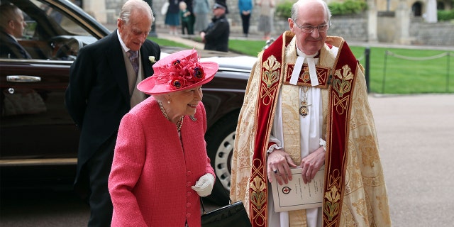 Queen Elizabeth II and Prince Philip arrive for the wedding of Lady Gabriella Windsor and Thomas Kingston at St George's Chapel, Windsor Castle, near London, England, Saturday, May 18, 2019. (Steve Parsons/Pool via AP)