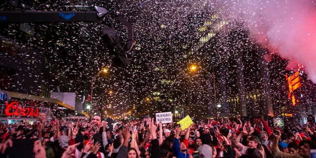 Toronto Raptors fans react after the team's 100-94 win over the Milwaukee Bucks in Game 6 of the NBA basketball playoffs Eastern Conference finals, outside Scotiabank Arena on Saturday, May 25, 2019, in Toronto.