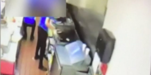 The three teenagers were caught on surveillance video spitting in the food before delivering it to the officers.
