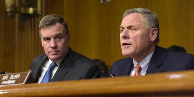 Chairman of the Senate Intelligence Committee. Senator Richard Burr, RN.C., right, accompanied by Vice President, Senator Mark Warner, D-Va., Left, at a Senate Intelligence Committee hearing on Capitol Hill in Washington Thursday, March 30, 2017. (AP Photo / Susan Walsh) (The Associated Press)