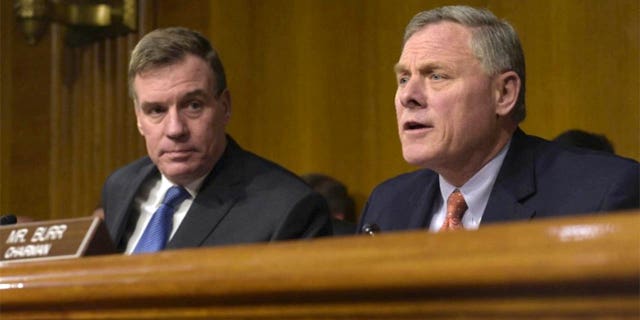 Senate Intelligence Committee Chairman Richard Burr, R-N.C., right, joined by Vice Chairman Mark Warner, D-Va., at a Senate Intelligence Committee hearing on Capitol Hill in 2017. (AP Photo/Susan Walsh) (The Associated Press)