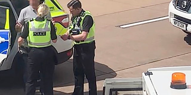 The passenger, who was escorted off the flight by police, was reportedly part of a larger group of rowdy fliers.