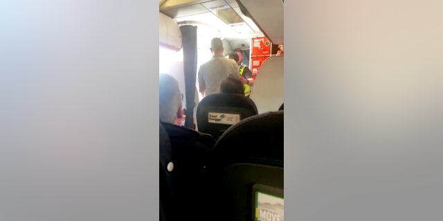 "As police escorted him off, the lady in the cabin crew was in floods of tears, and was saying that she didn't feel safe on that flight,” a witness said.