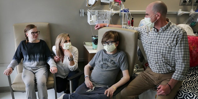 May 6, 2019: Ava Shepperd, 14, left, and her brother John Ben Shepperd, second from right, sit with their parents Kim Azar Shepperd, and John Shepperd, right, at University Transplant Center, in San Antonio, Texas. 