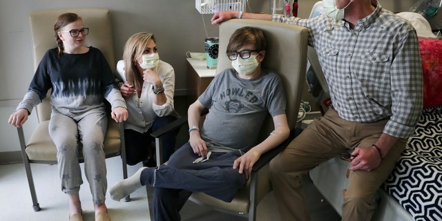 May 6, 2019: Ava Shepperd, 14, left, and her brother John Ben Shepperd, second from right, sit with their parents Kim Azar Shepperd, and John Shepperd, right, at University Transplant Center, in San Antonio, Texas.