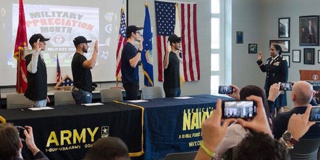 Four students at Becton Regional High School in New Jersey signed their intent to join the armed forces at the school's first "military signing day."