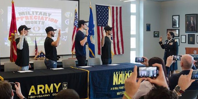 Four students at Becton Regional High School in New Jersey signed their intent to join the armed forces at the school's first "military signing day."